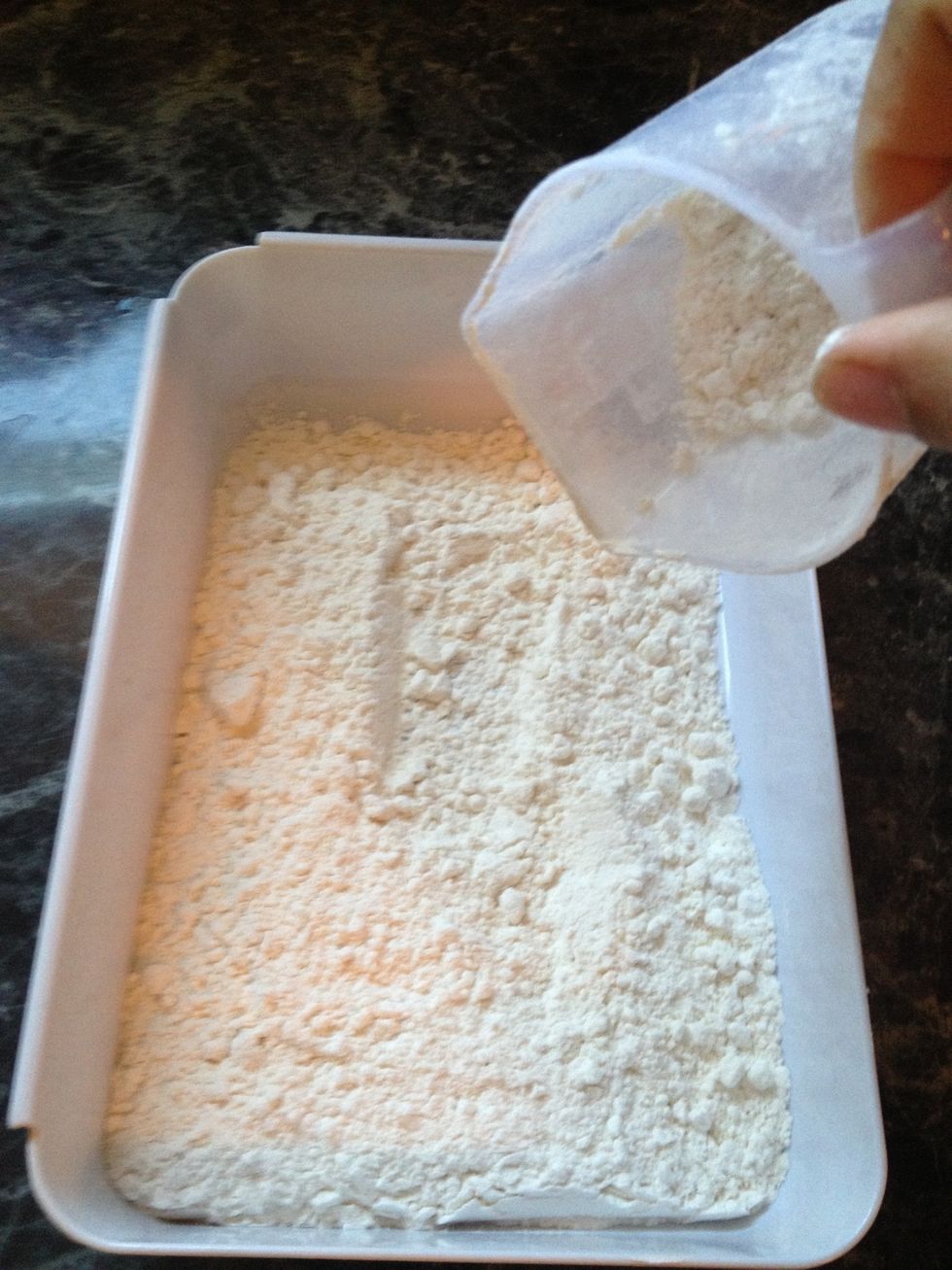 After the chicken has marinated take the chicken out of the fridge and bring it to room temp. Take the flour next and put it in a bowl.