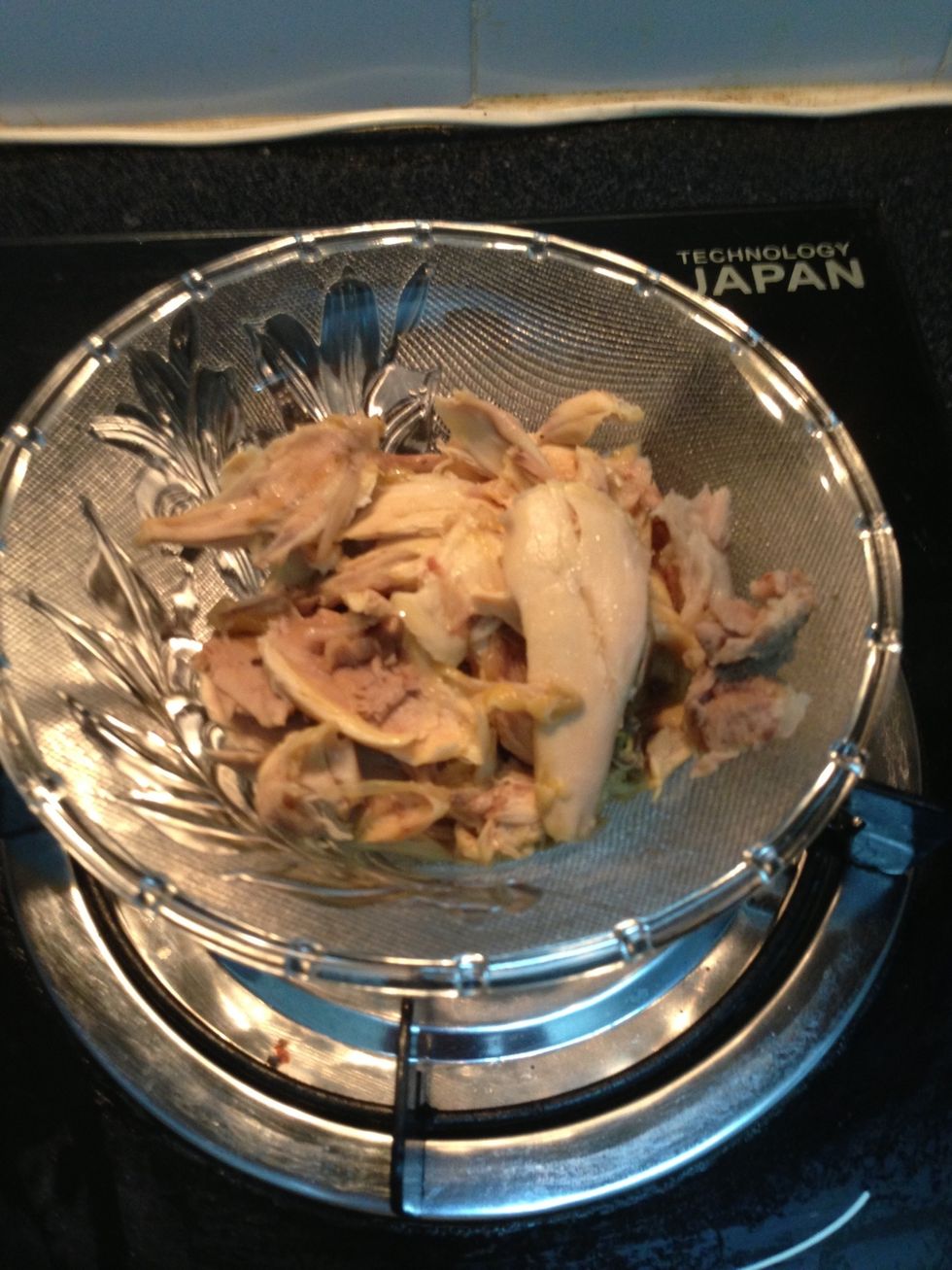 After the chicken is cooked for ~ 15min, take it out, take the meat out and put the bones back in the broth (for the flavour).