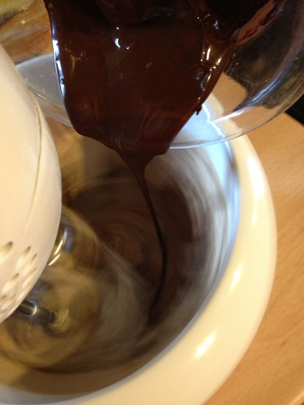 After the eggs are done beating with the mix, add the melted chocolate