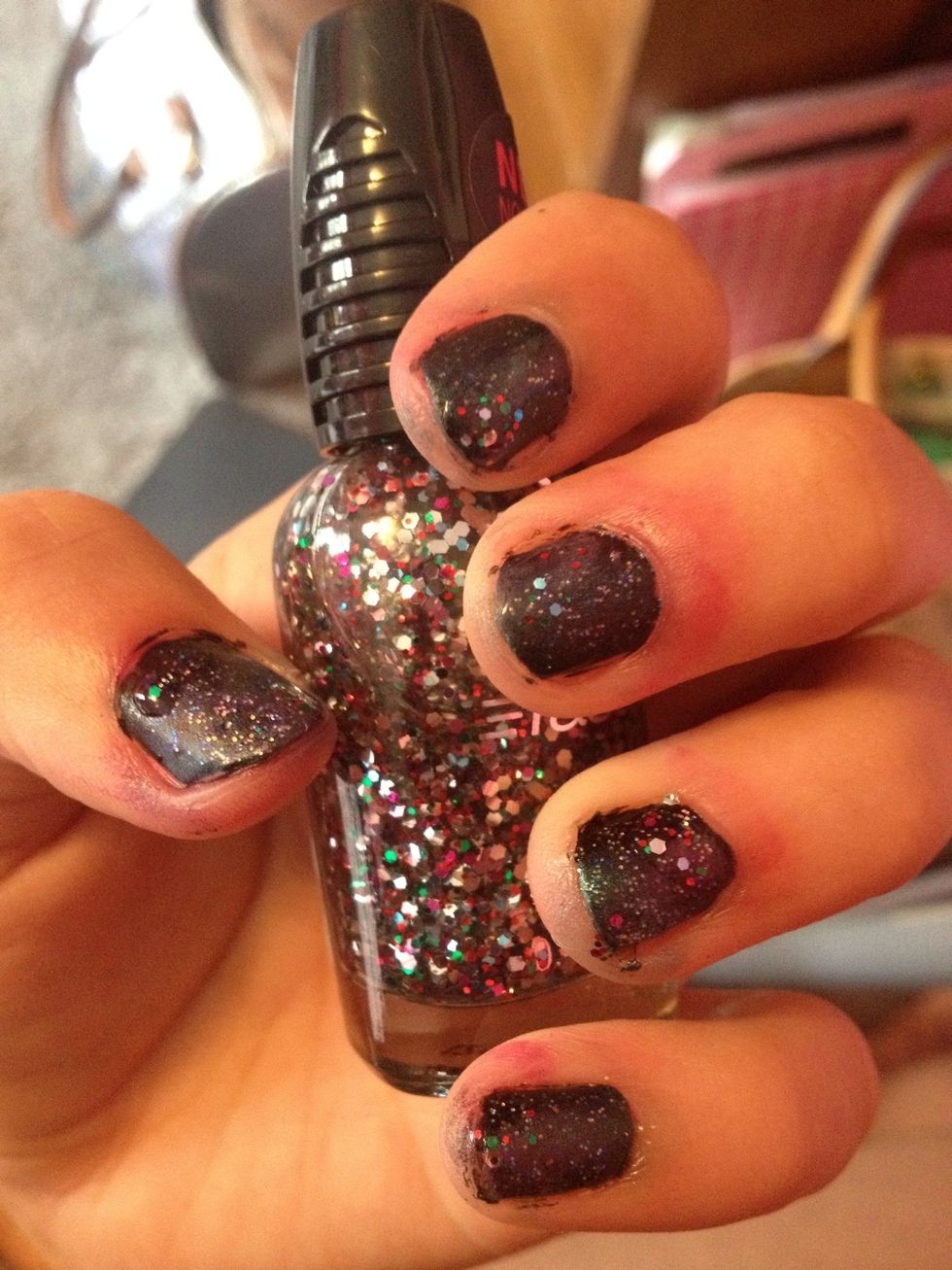 After the fine glitter dried I went back and sponge on some more blue as needed. Next, I add random chunks of Wet n Wild's "Party of Five Glitters (238C)" to add some more sparkle.. It's optional. :)