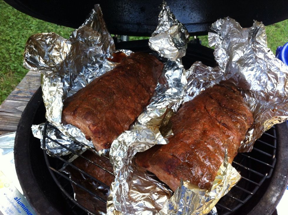 After the first hour remove ribs, turn over in foil (so the top of the rib is facing down). Rotate the ribs (ones that were on bottom the first hour now on top). Keep temp. 225-250 for next hour.