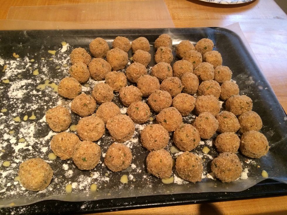 After the flour, dip the balls in the egg/milk mixture, then into the Italian bread crumbs. Didn't get a picture of this process, TOO MESSY!!