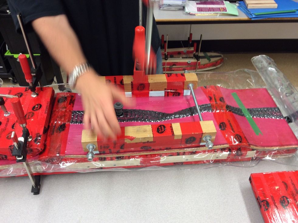 After the glue has dried and everything is together you can then start taking off your clamps and begin taking the board out of the bag.