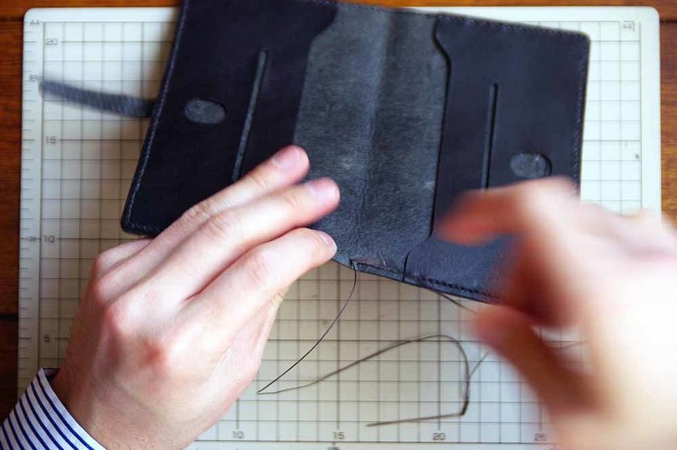 After the glue has dried, sew it with the wax cord.