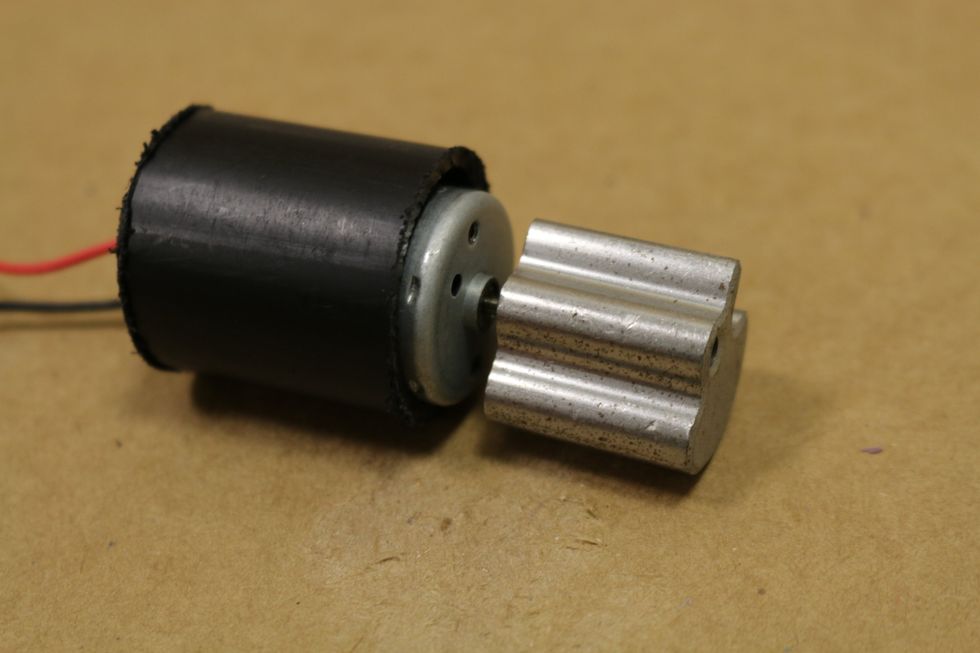 After the glue is cooled, test the motor by hooking it directly to   a battery to make sure that it is working (and shaking).
