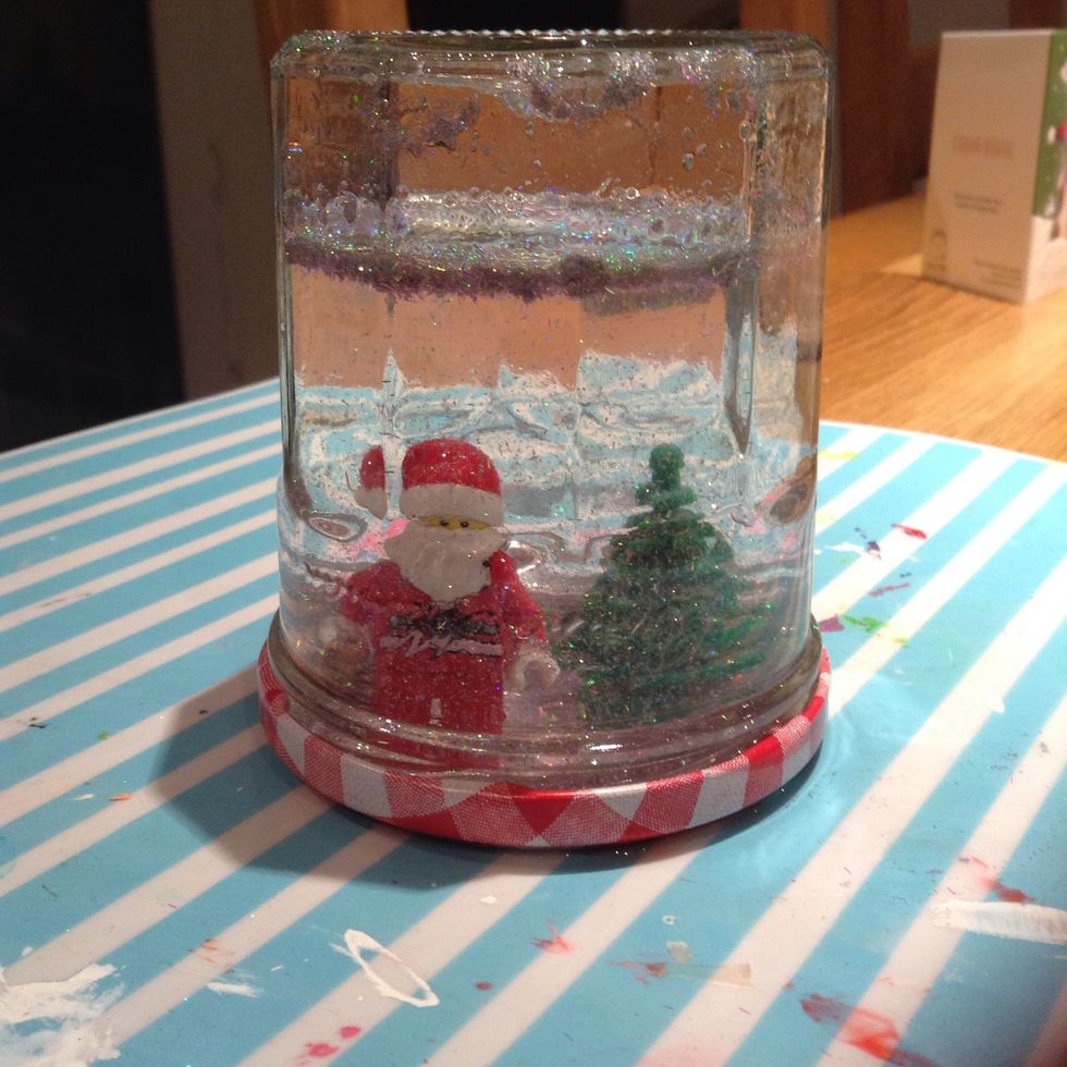 After the glue is dry , screw on the lid and turn the jar upside - down