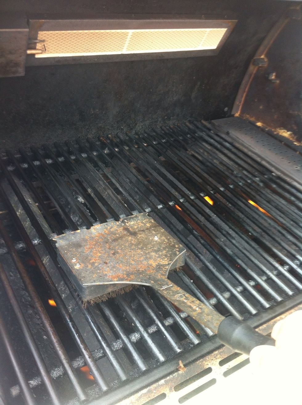 After the grill is preheated, scrape any remaining bits with a wire grill brush.