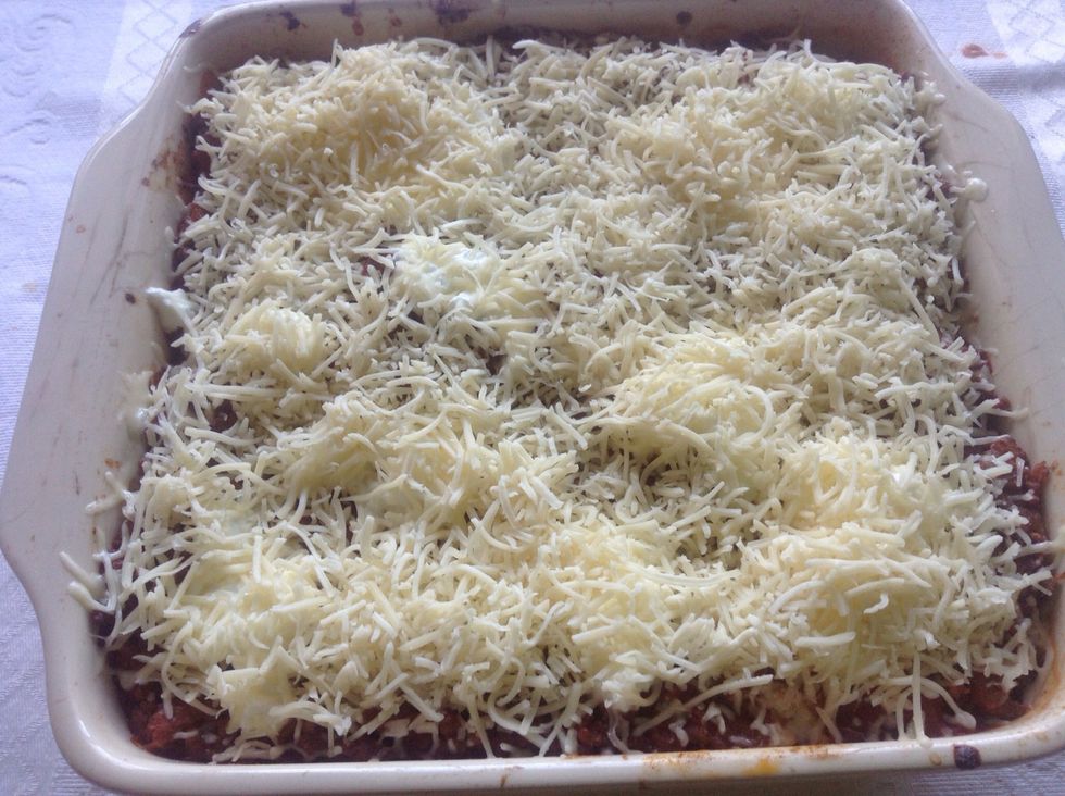 After the last layer, I usually try to cover with bolognaise sauce, and then, cheese on top .. That way, covered with the tomato sauce, the pasta won't dry ..