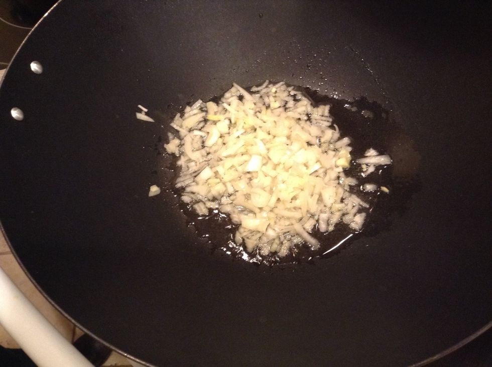 After the oil is heated, add the onions and cook for 2-3 minutes until they appear to be translucent. Be sure to stir it every so often