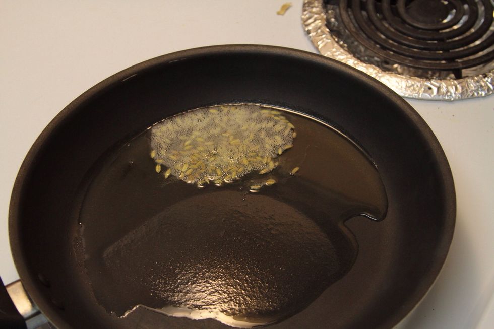After the oil is warm add the fennel seeds