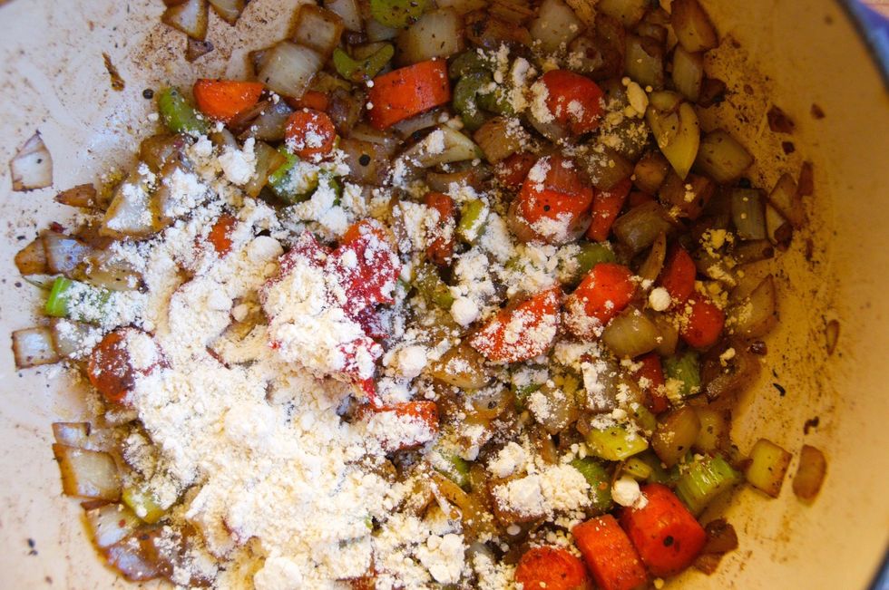After the onions are translucent, add the tomato paste and flour.  Mix well and cook down for another 5 minutes to deepen the color and flavor of the tomato paste.