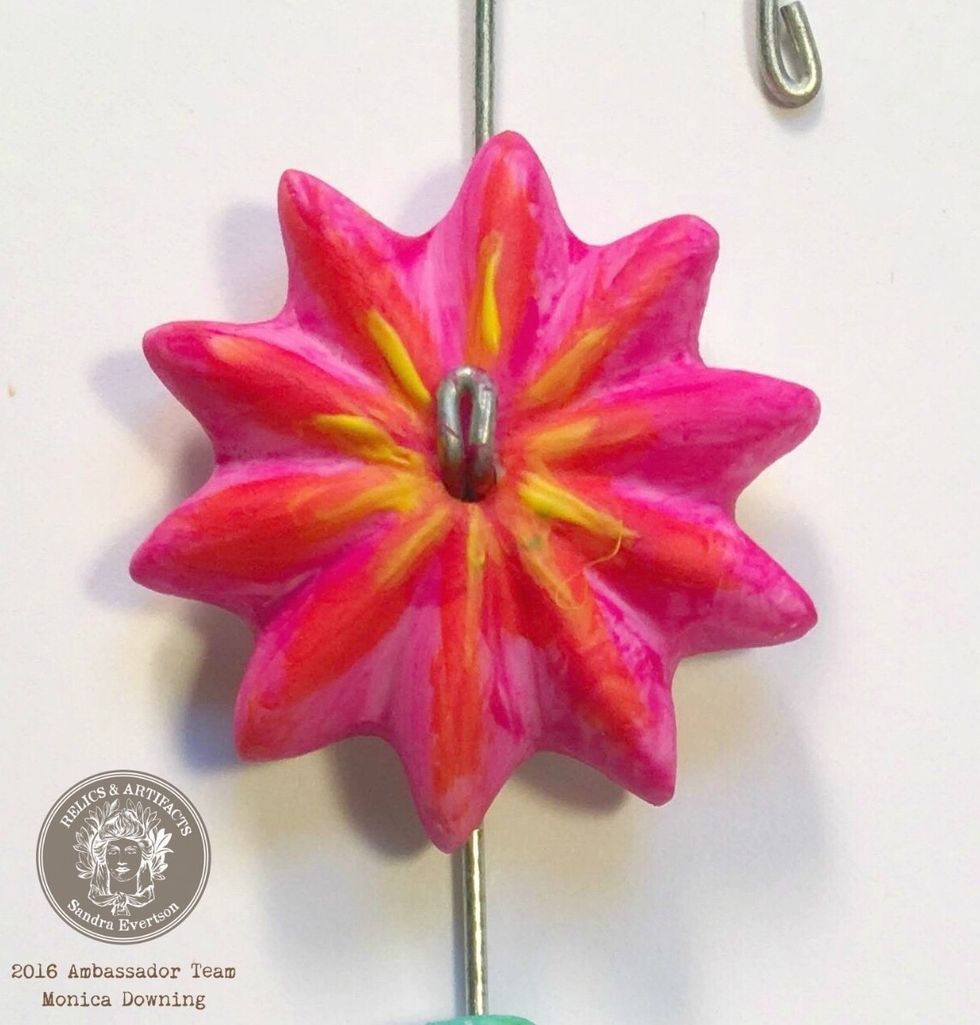 After the orange dried I added some fine yellow lines from the middle of the flower going out towards the ends of the petals.