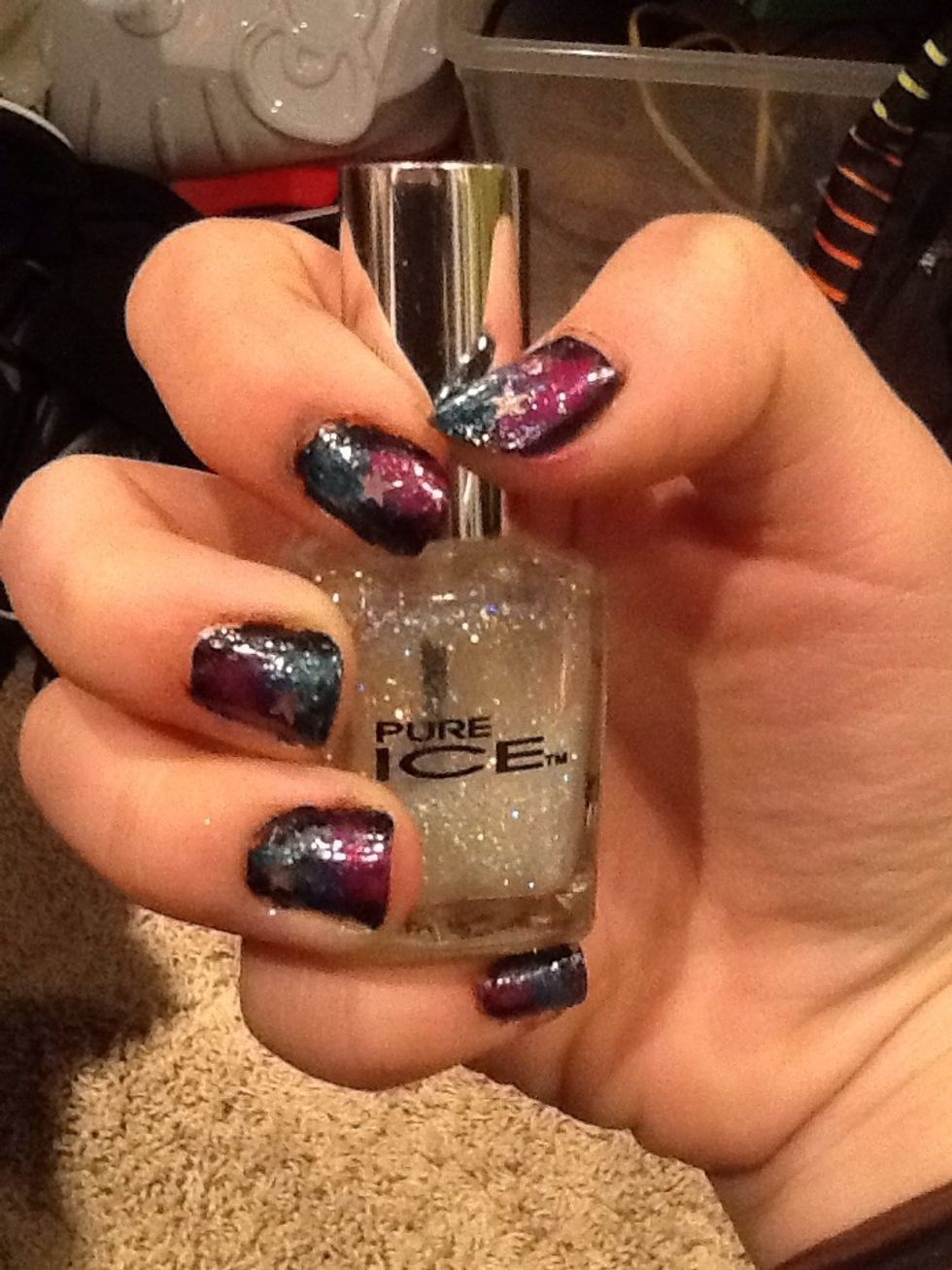 After the pink nail polish has dried, get your glitter nail polish and apply it on your nails. You can also apply stars on your nails.