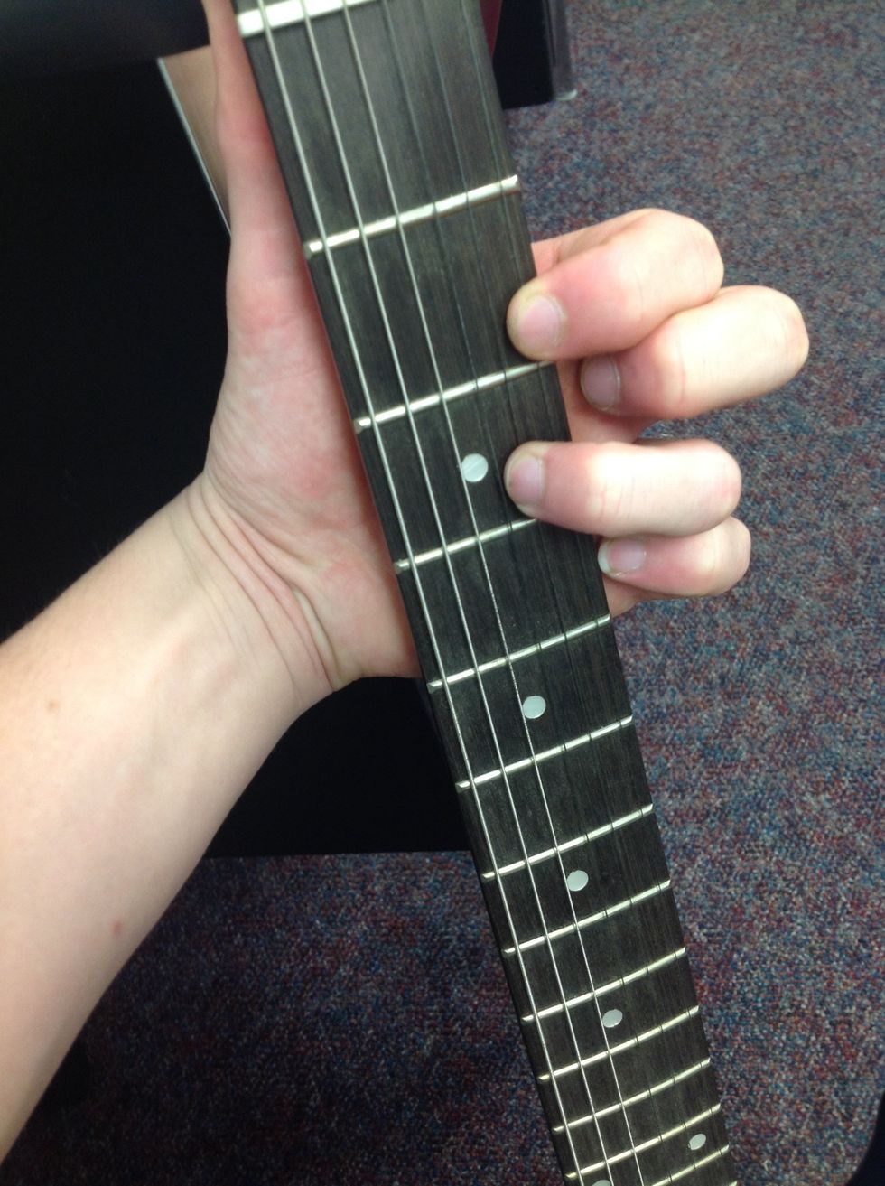 After the previous step, next place your second finger on the second fret of the high  E string.