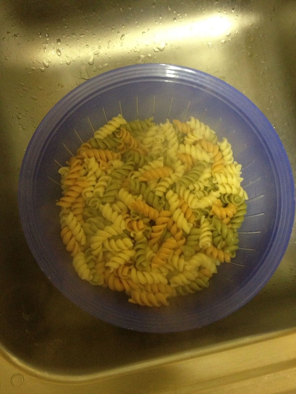 After the rotini is done cooking and is tender, drain it.