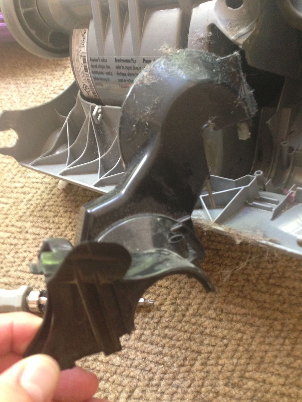 After the screws are removed lift that cover out. Notice the silver pin at the top make sure it comes out as well. The third screw location is almost seen here. Above that pin