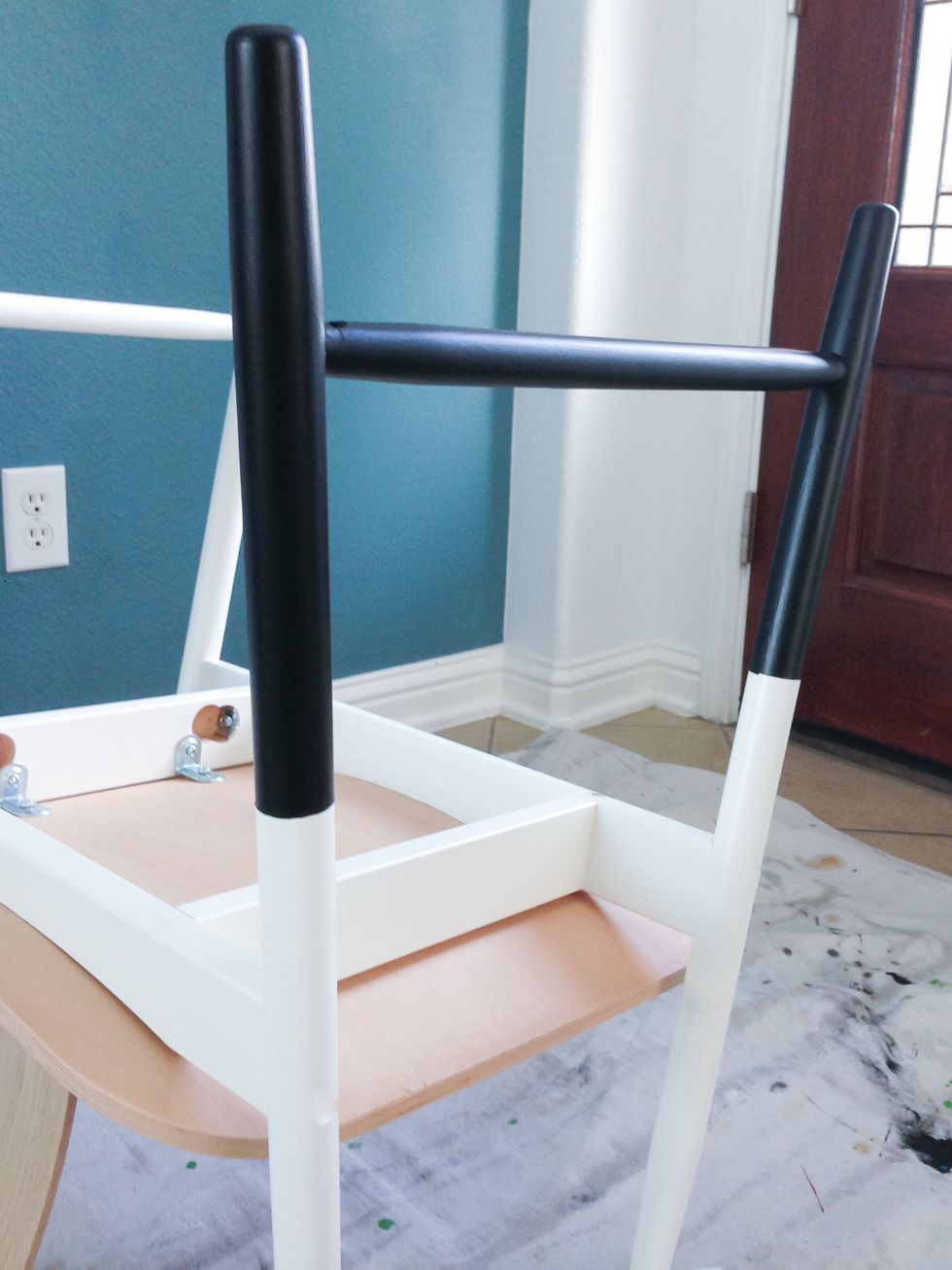 After the second coat dried, I carefully peeled away the painters tape and plastic. I left my chair upside down for about 24 hours to make sure the paint had hardened.