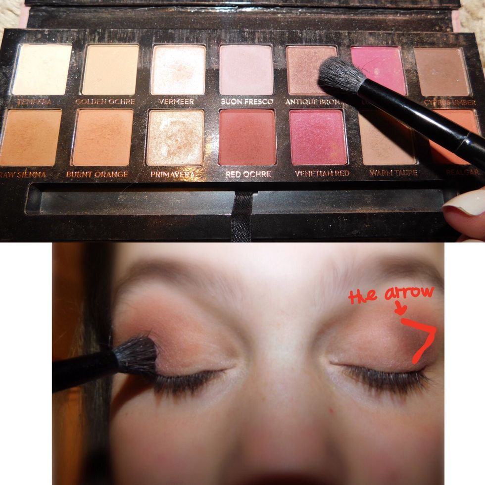 After the second color, take a dark color, usually brown, and tap a little of it into your blending brush. Make a small arrow on the end of your crease, to create dimension.