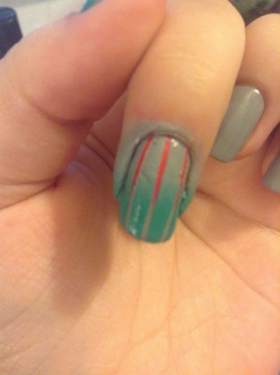 After the tape is off. Top coat and clean up with a small brush or q-tip and polish remover.