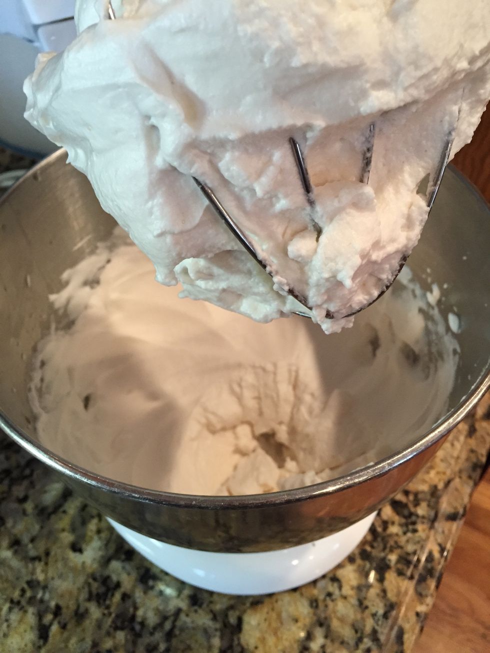 After the two minutes, add a TB of sugar and 2 TB vanilla. Beat another two minutes and turn off to wait for syrup to reach correct temp.