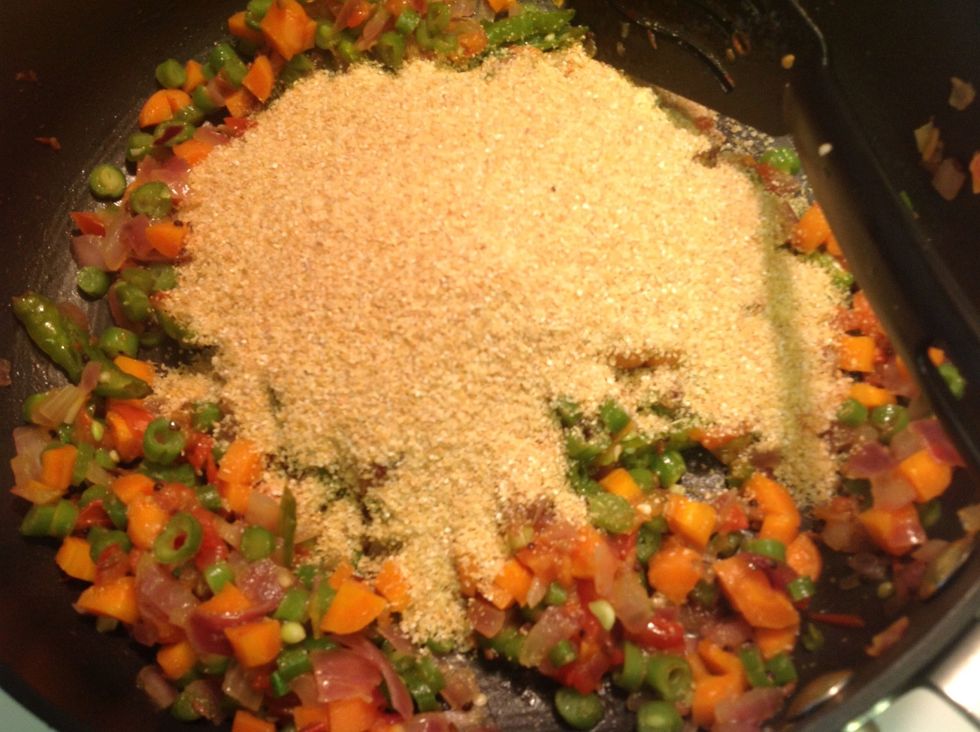 After the veggies turn tender add in the dry roasted couscous or wheat rava