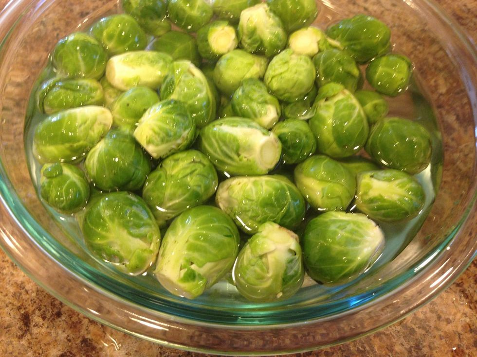 After they are all trimmed and ready to go, place them back in the bowl with the clean water.