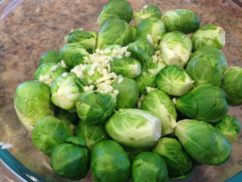 After they are done, pull them out and drain the water. Place in the bowl for a third time....no water this time....and add the diced garlic.