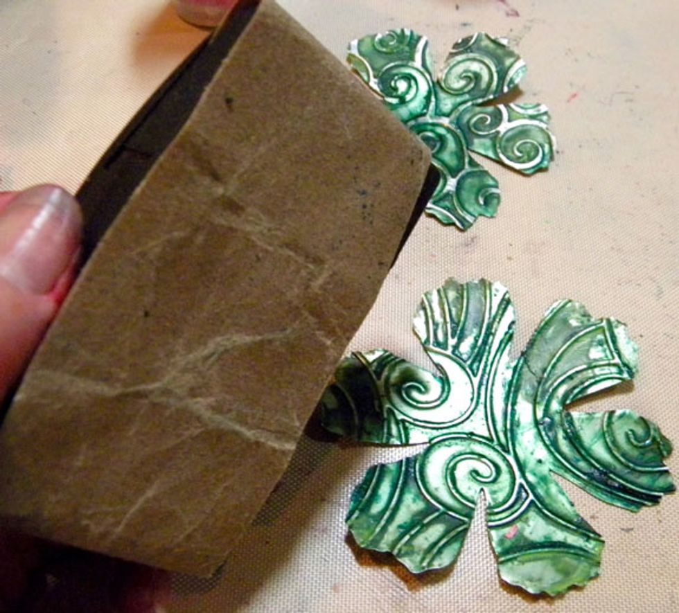 After they are dry, lightly sand the surface of each die-cut to reveal the silver raised areas.