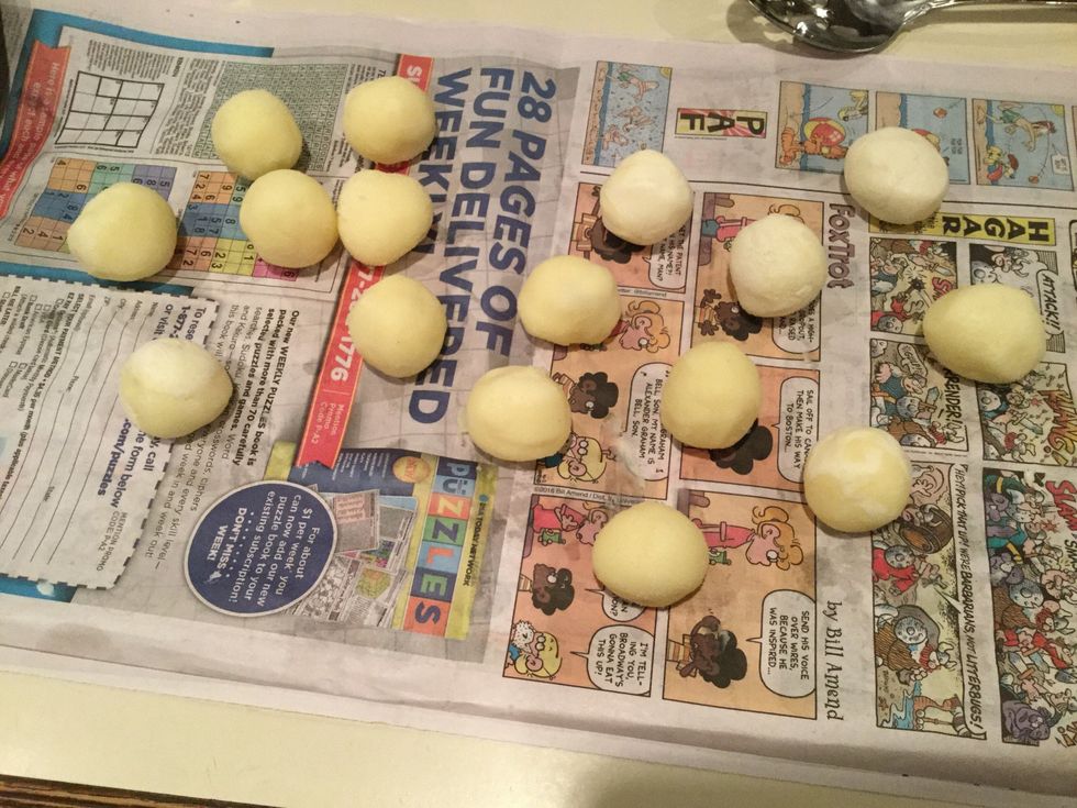 After they have set completely, take them out and roll them into  balls. Lay out a pice of newspaper and place the balls on the newspaper to set for a couple minutes.