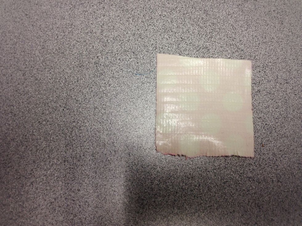 After this, you can start making the "petals" of the flower. Cut another two inch piece of duct tape.