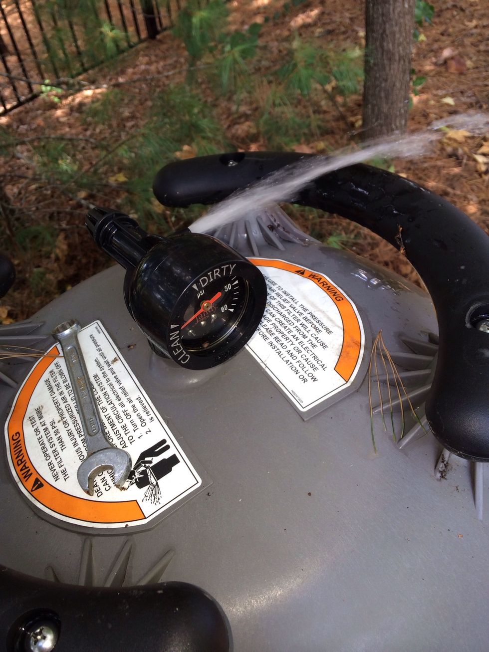 After tightening the band around the filter (don't over tighten) and replace the drain cap you're ready to turn on the power and turn on the pump. Close the air release when water comes out the top