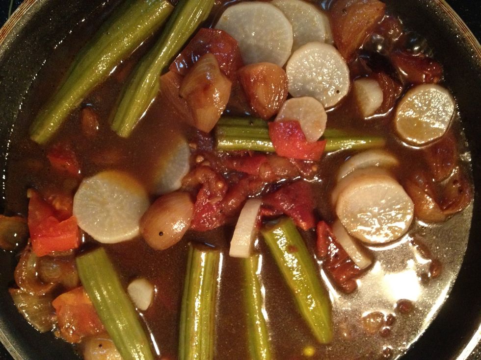 After tomatoes are done Add the boiled vegetables , tamarind paste and salt to taste and Let it boil for 5-10 mins. When done add this flavorful mixture to the lentils and bring it to a boil