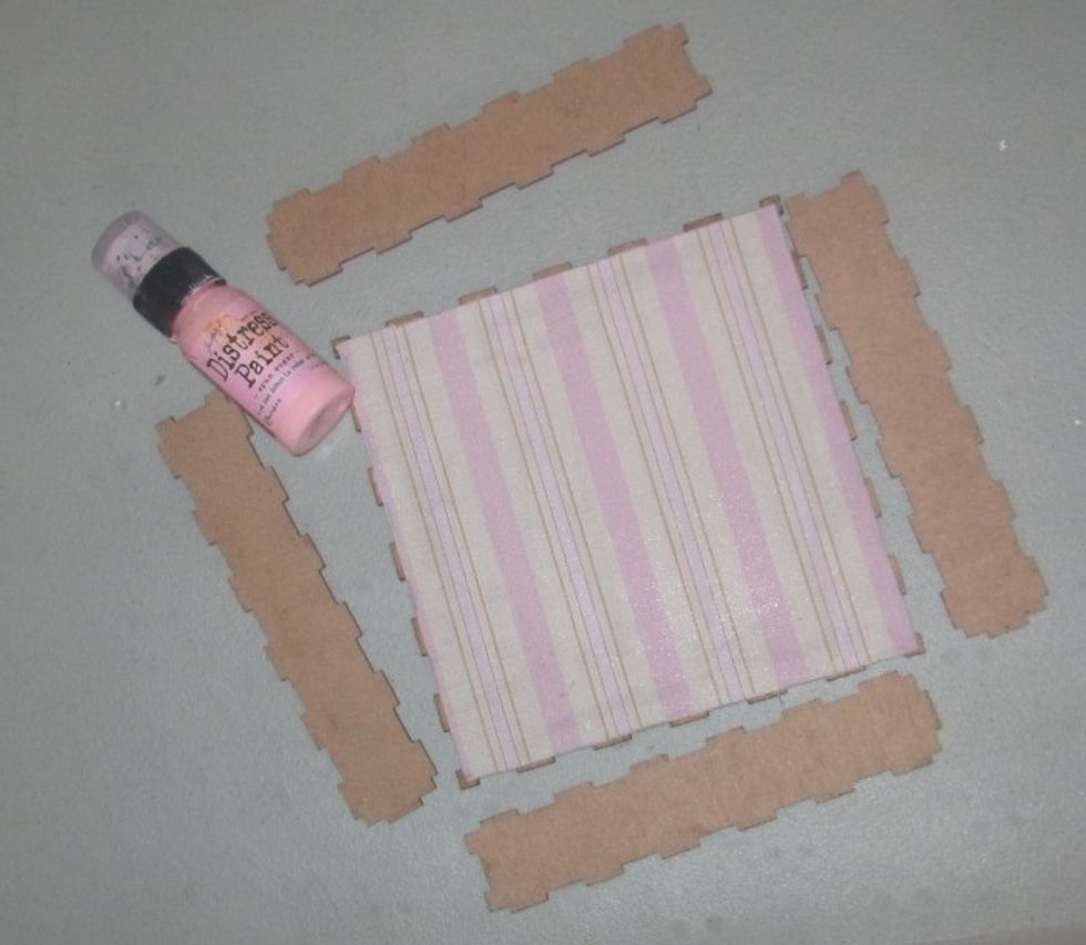 After trimming off the excess fabric, I chose a coordinating shade of Distress Paint to add color to the inner sides and outside of the shadow box.