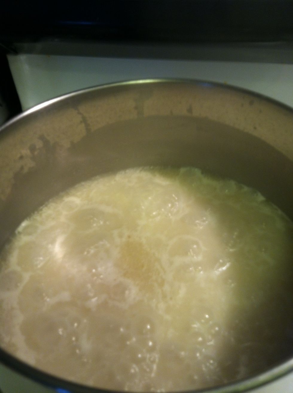 After turning the heat down stir rice. Let it sit an boil til the water boils down and the rice becomes visible to the surface.