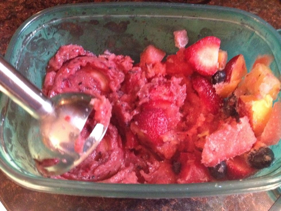 After two hours remove fruit container from freezer and emulsify fruit - you may need to put a little elbow into it - fruit on left is how it should look as you are emulsifying.