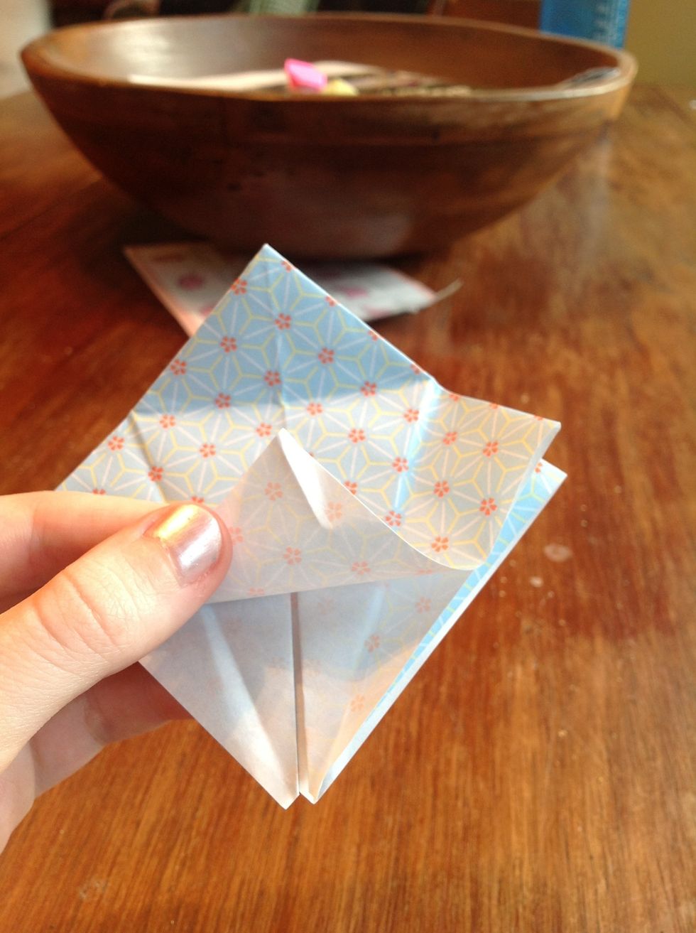 After unfolding , lift the bottom corner