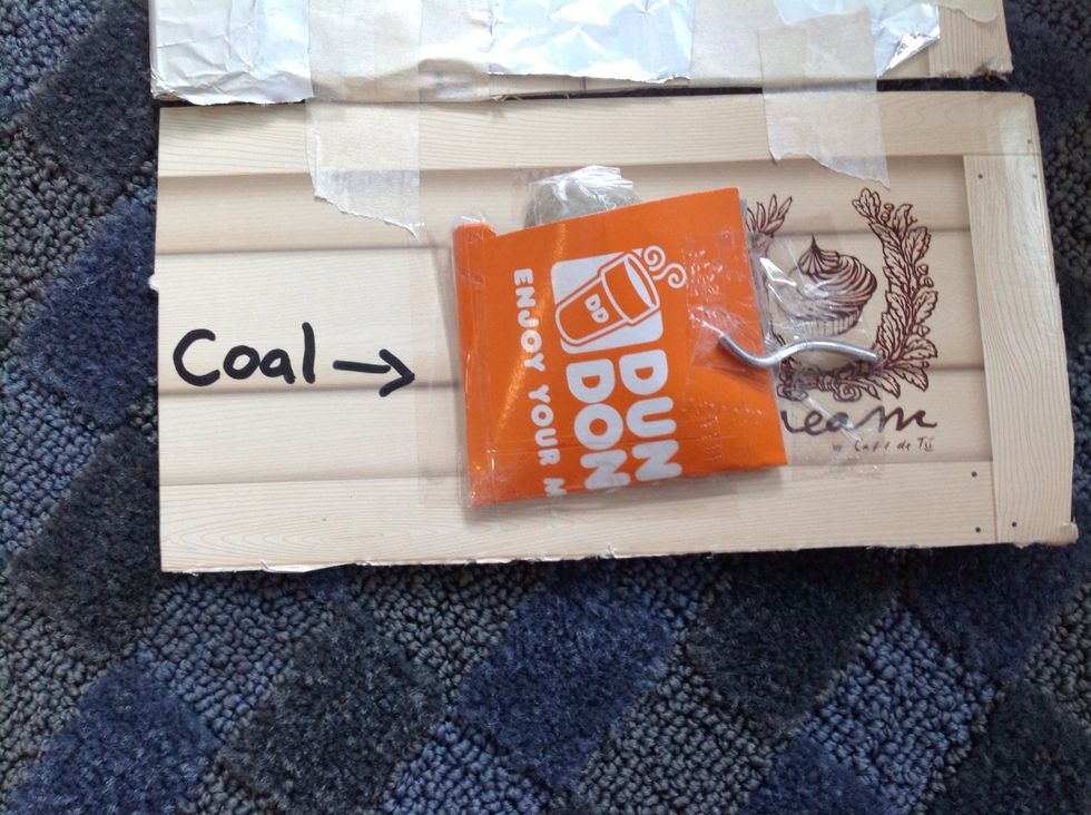 After, use the matches to set the coal on fire.
