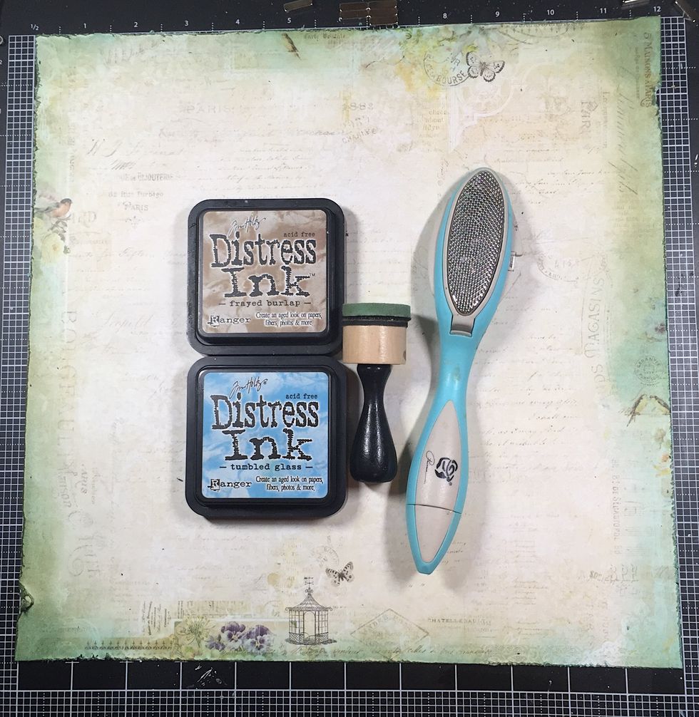 After using the distresser, I used the Tumbled Glass distress ink first, being sure to ink deep into the edges of the page, then Frayed Burlap on the edges, leaving some of the blue exposed.