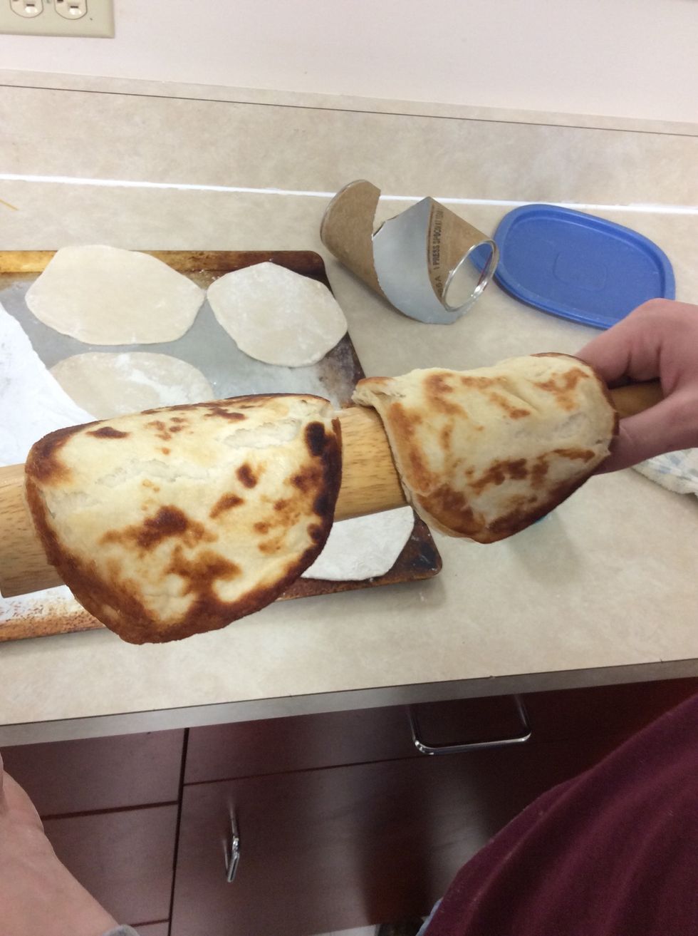 After we fried the biscuits we placed them on the rolling pin to make them into a U shape and then we set them in the fridge
