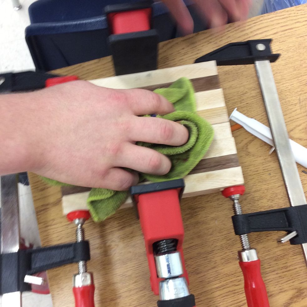 After you are done gluing you need to use clamps to hold it tight in place while you wipe off all the extra glue dripping from your board.