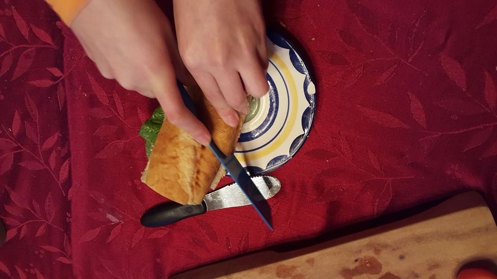 after you are done making the sandwich you can take the cutting knife and cut your sandwich in half or even diagonally to make it easier to eat :)