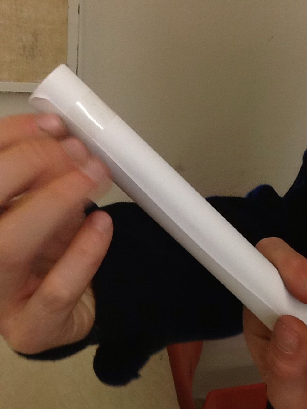 After you are done rolling your tube,hold it in the middle and put tape on each side.Then hold it on any side and tape the middle.