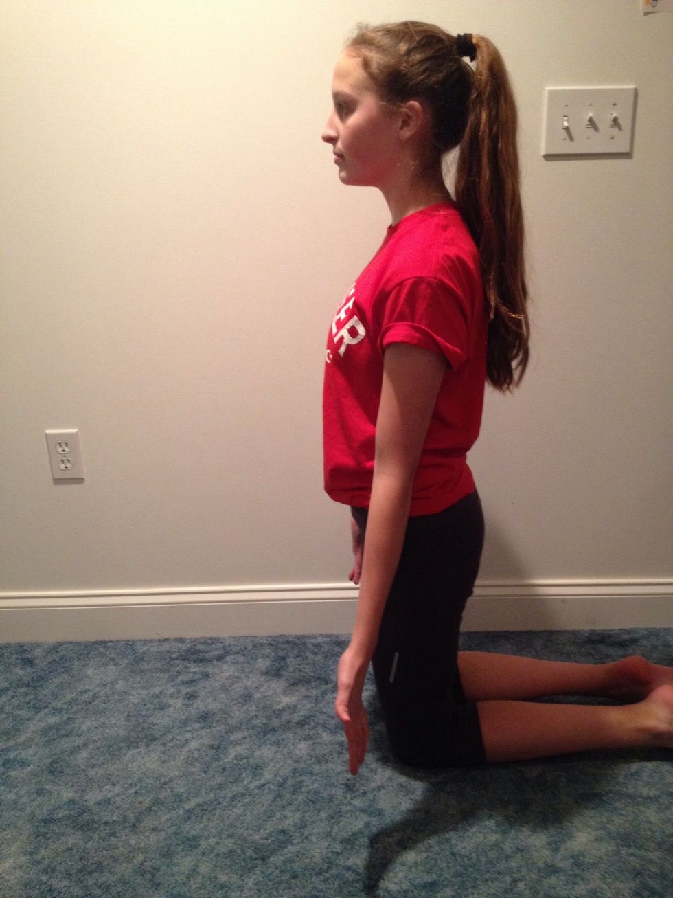 After you are stretched, get on your knees and sit up straight.