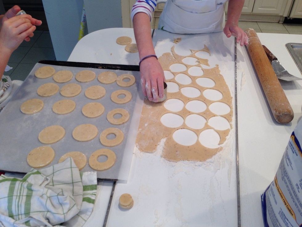 After you cut all the circles, use the small cutter to cut the center out of half. Bake at 350 for 12 minutes. Don't let the tops get brown, just the bottoms.