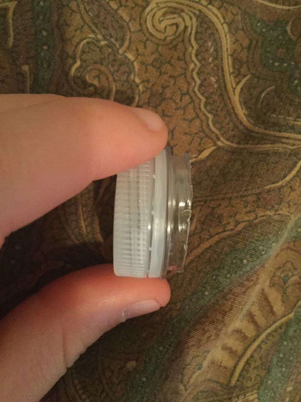 After you cut the first bottle almost to the top grab its cap and put on the top