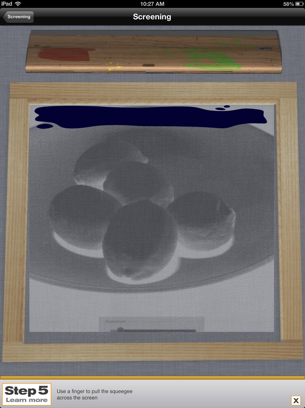 After you finish the underpainting, select a color for your negative. Pull the squeegee from top to bottom then release.