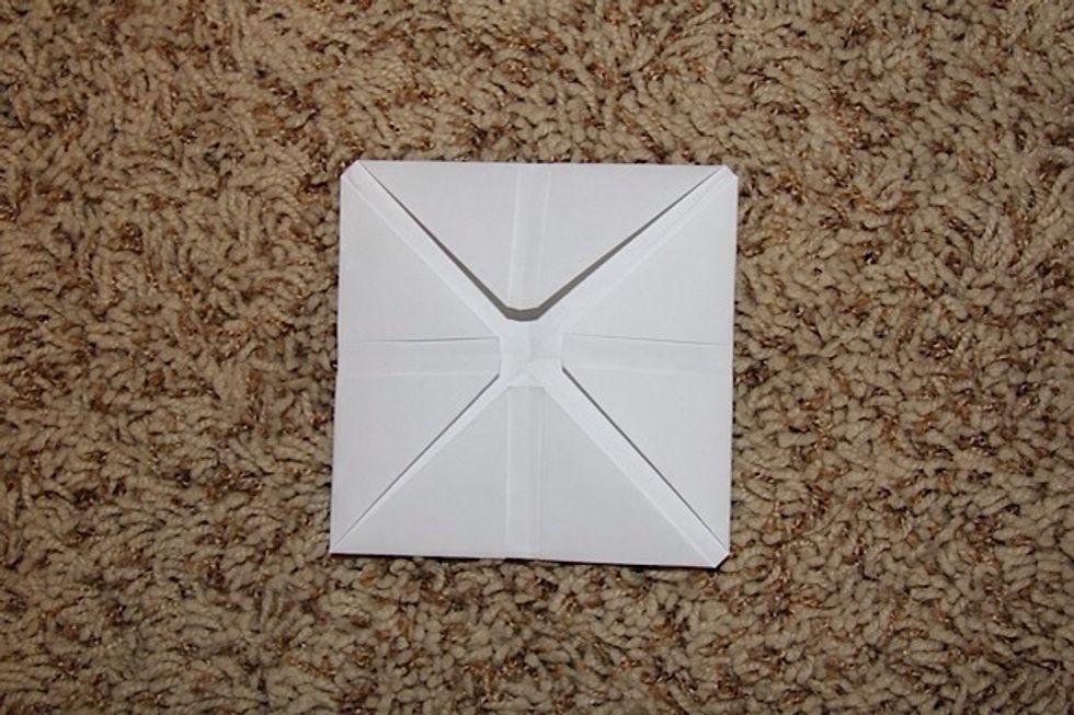 After you folded all of the corners in, it should look like this :)