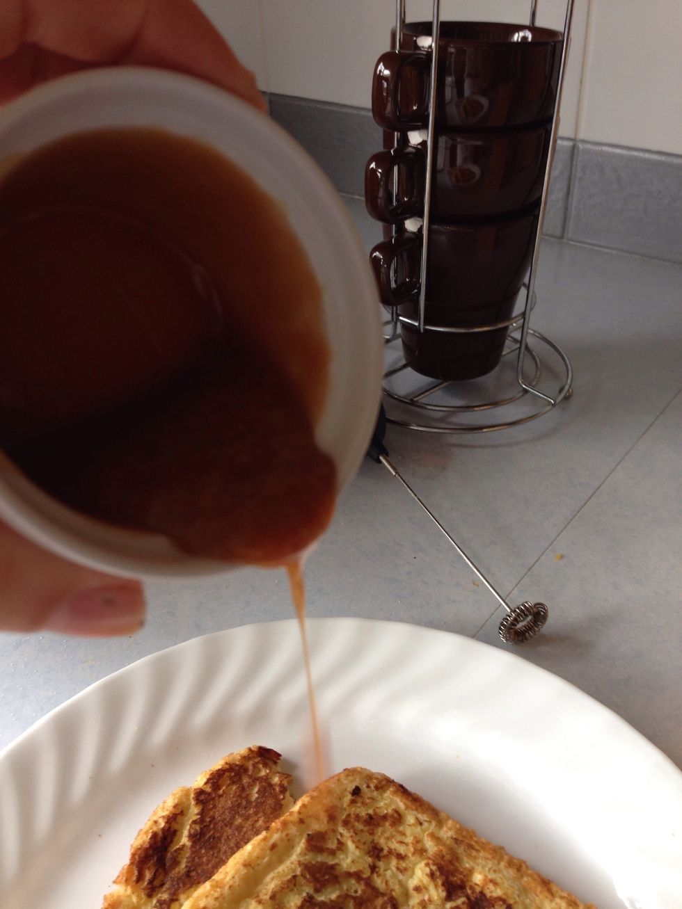 After you fry the bread, pour caramel on it. Mine is homemade, store bought is ok too, if I get comments I will include a homemade caramel tutorial next!