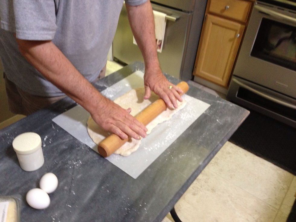 After you get it pretty flat, it might be easier to use a floured rolling pin - either way, you want it to be about a quarter inch thick.