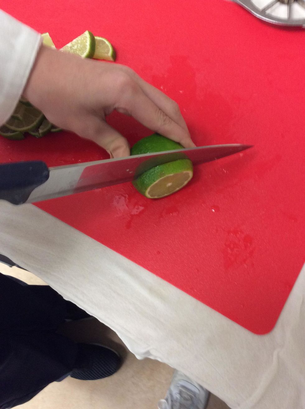 After you had cut off the edges, now you cut the lime into a 1/3" so that it can be a little thick and continue with this process for all the lemons